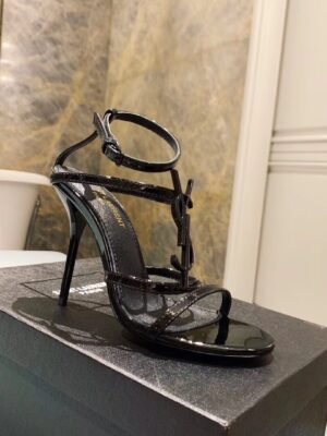 CASSANDRA FLAT SANDALS IN CROCODILE-EMBOSSED LEATHER WITH GOLD-TONE MONOGRAM