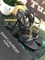 CASSANDRA FLAT SANDALS IN CROCODILE-EMBOSSED LEATHER WITH GOLD-TONE MONOGRAM