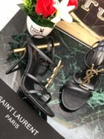 CASSANDRA FLAT SANDALS IN CROCODILE-EMBOSSED LEATHER WITH GOLD-TONE MONOGRAM