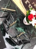 CASSANDRA FLAT SANDALS IN CROCODILE-EMBOSSED LEATHER WITH GOLD-TONE MONOGRAM