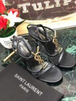 CASSANDRA FLAT SANDALS IN CROCODILE-EMBOSSED LEATHER WITH GOLD-TONE MONOGRAM