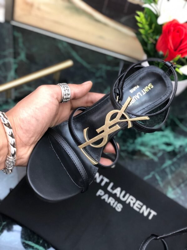 CASSANDRA FLAT SANDALS IN CROCODILE-EMBOSSED LEATHER WITH GOLD-TONE MONOGRAM